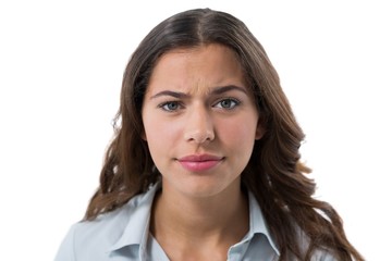 Confused female executive against white background