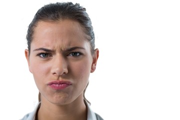 Confused female executive against white background