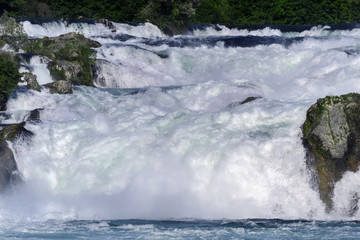 Boiling powerful water streams fall with splashes creating waves, background