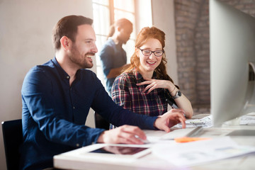Portrait of young designers working on computer