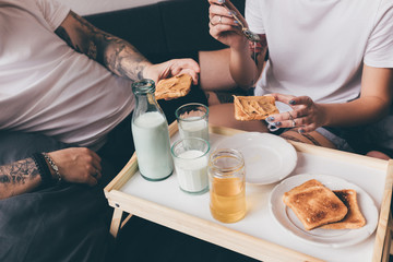 couple having breakfast together in bed