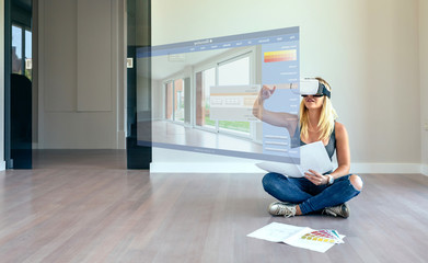 Young woman using decoration application with virtual reality glasses