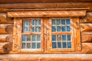 Obraz na płótnie Canvas An old wooden house windows