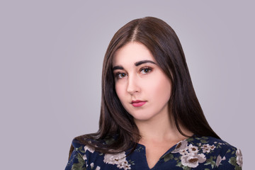 Obraz premium Portrait of gorgeous young woman on grey background