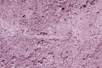 Violet color grungy cement wall pattern.