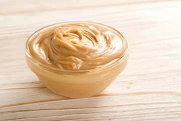 peanuts butter on a wooden background