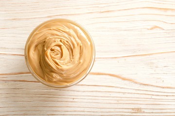 peanuts butter on a wooden background
