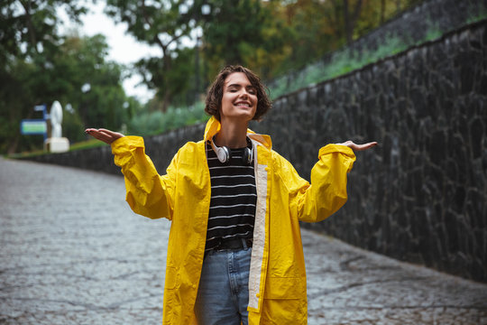 Portrait of a happy teenage girl wearing raincoat