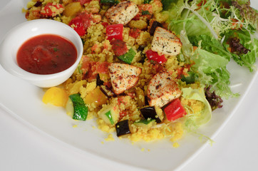 Сouscous with cheese paneer and vegetables with salad mix and tomato sauce