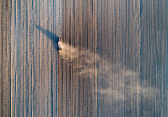 Top view of tractor harrowing soil