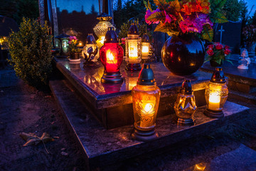 Colorful candles on the cemetery at All Saints Day