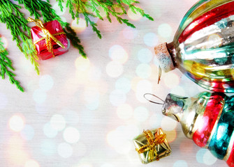 retro glass christmas toys on wooden panel in xmas lights