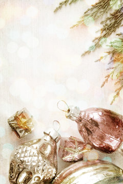 retro glass christmas toys on wooden panel . image in vintage grunge style