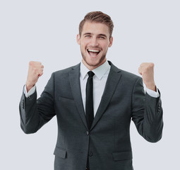 Businessman celebrating  with his fists raised in the air and a 