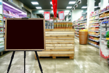 Supermarket, defocused image of the grocery department. Place for your text.