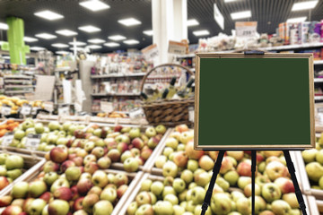 Fruit department in the supermarket. Defocused image. Place for your text.