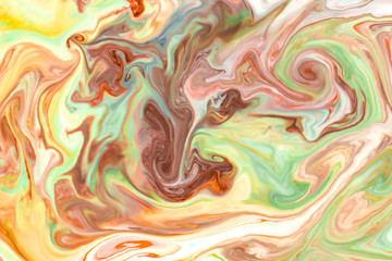 Artistic abstract design created with mixing color liquids. Colorful background texture. Liquids mixing on water surface