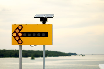 Arrow traffic solar signs on nature background