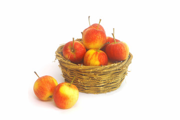 Fresh Little Apples in basket on wihte background