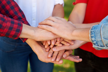 Student teamwork. Closeup of man amd woman hans together stack. Friendship forever, togetherness, youth team concept
