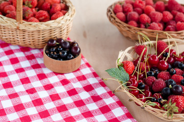 Fresh summer berries in baskets.