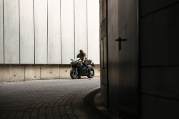 Naklejka premium Portrait of a young african man riding motorbike