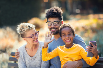 Happy young mixed race couple spending time with their daughter