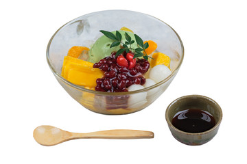 Isolated Matcha (Green Tea) ice cream served with jack fruit, lychee, orange, coconut jelly and red bean paste.