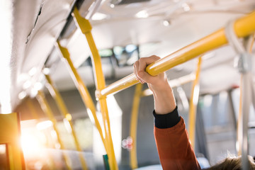 person standing in bus