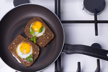 toasted scrambled eggs  cooking in a frying  pan.