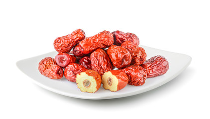 Dried red date or Chinese jujube in a plate isolated on white background