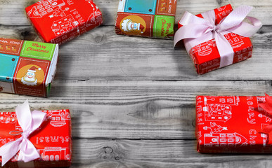 Fototapeta premium the christmas gift boxes on the wooden table with space
