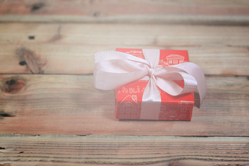 the christmas gift box on the wooden table