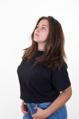 Portrait of a pretty young woman standing against white background