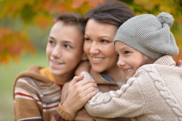happy mother with children outdoors