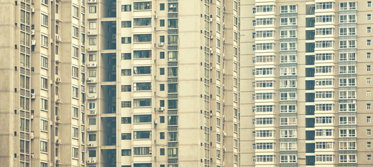 Retro stylized picture of apartment buildings, urban background.
