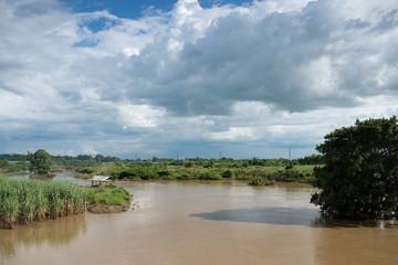 Countryside landscape and hut in river