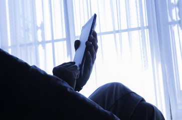 man using smartphone in the room in silhouette style - 177287354