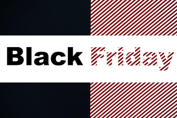 Creative text Black Friday on black, red and white striped background