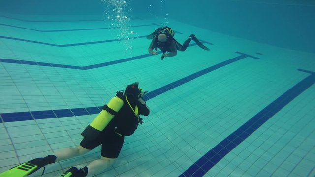 Training divers in the pool.