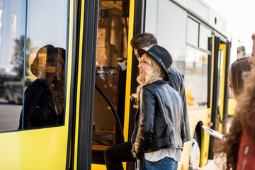 couple entering bus