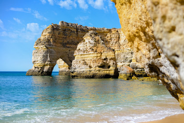 Algarve coastline and beautiful sunny cliffs ocean natural outdoors background. Idyllic dream travel destination