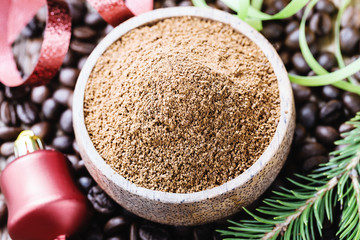 Whole and ground coffee beans  with christmas decorations