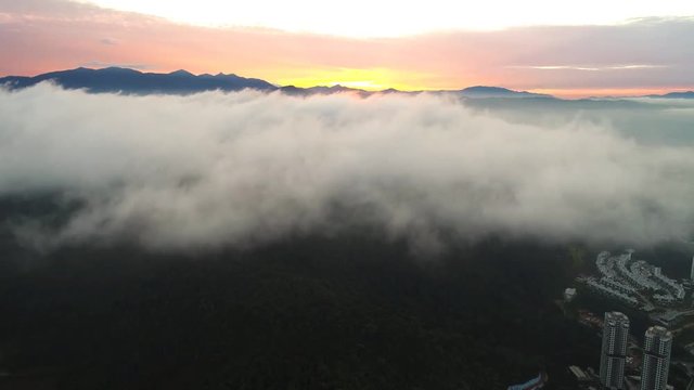 Aerial view. Descending below clouds accumulation level.