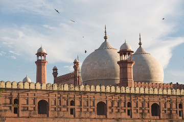 Fototapeta na wymiar The Emperor's Mosque - Badshahi Masjid in Lahore, Pakistan Dome with Minarets Exterior