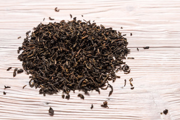 Black tea on wooden background