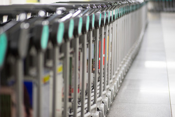 Row of luggage carts at the airport for transporting luggage.