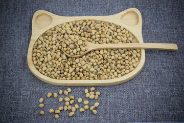 Soy milk in wood dish .
