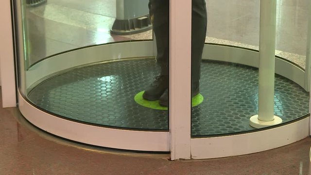 Employees pass through the entrance of the secret enterprise.The security system at the entrance .