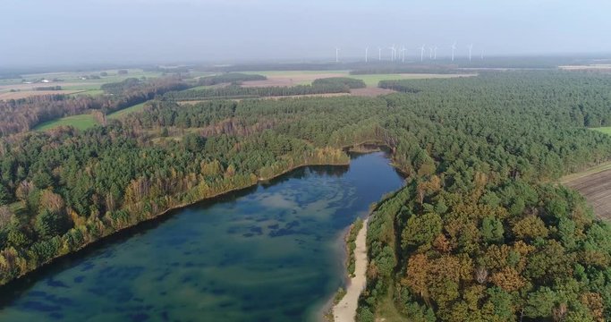 Long flight to the end of a lake with return flight to the shore at an altitude of one hundred meters, aerial view, L&uuml;neburger Heide, Lower Saxony, Germany
